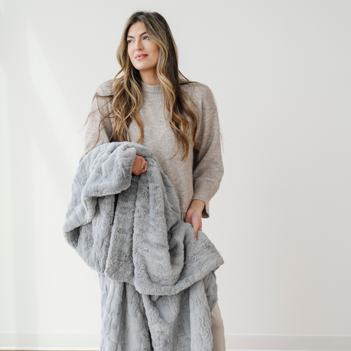 Patterned faux fur throw blanket in a cozy angle, perfect for baby nurseries and stylish comfort.