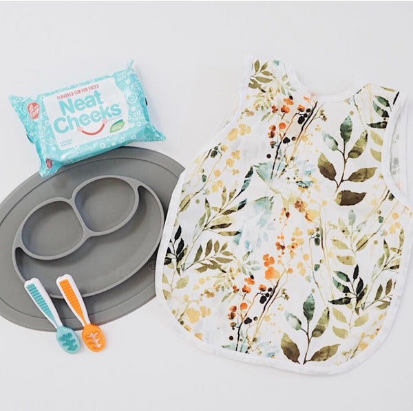 Autumn Leaves Bapron for babies, featuring a vibrant leaf design, angled view showcasing its unique style and functionality.