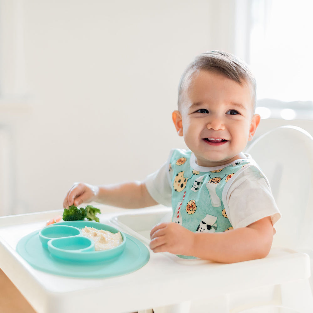 Cookies & Milk Bapron for babies, featuring a fun design and practical coverage for mess-free mealtime.