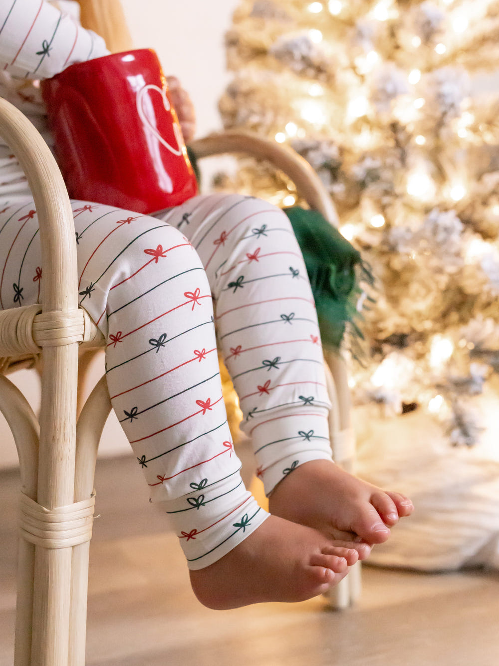 Tied with a Bow Christmas 2pc Henley Bamboo Pajamas for babies, perfect for cozy sleep and festive celebrations.