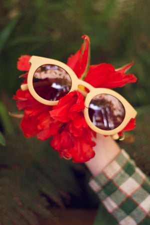 Classic sustainable sunglasses for kids aged 3-8, plant-based, bendable, polarized, angled view.