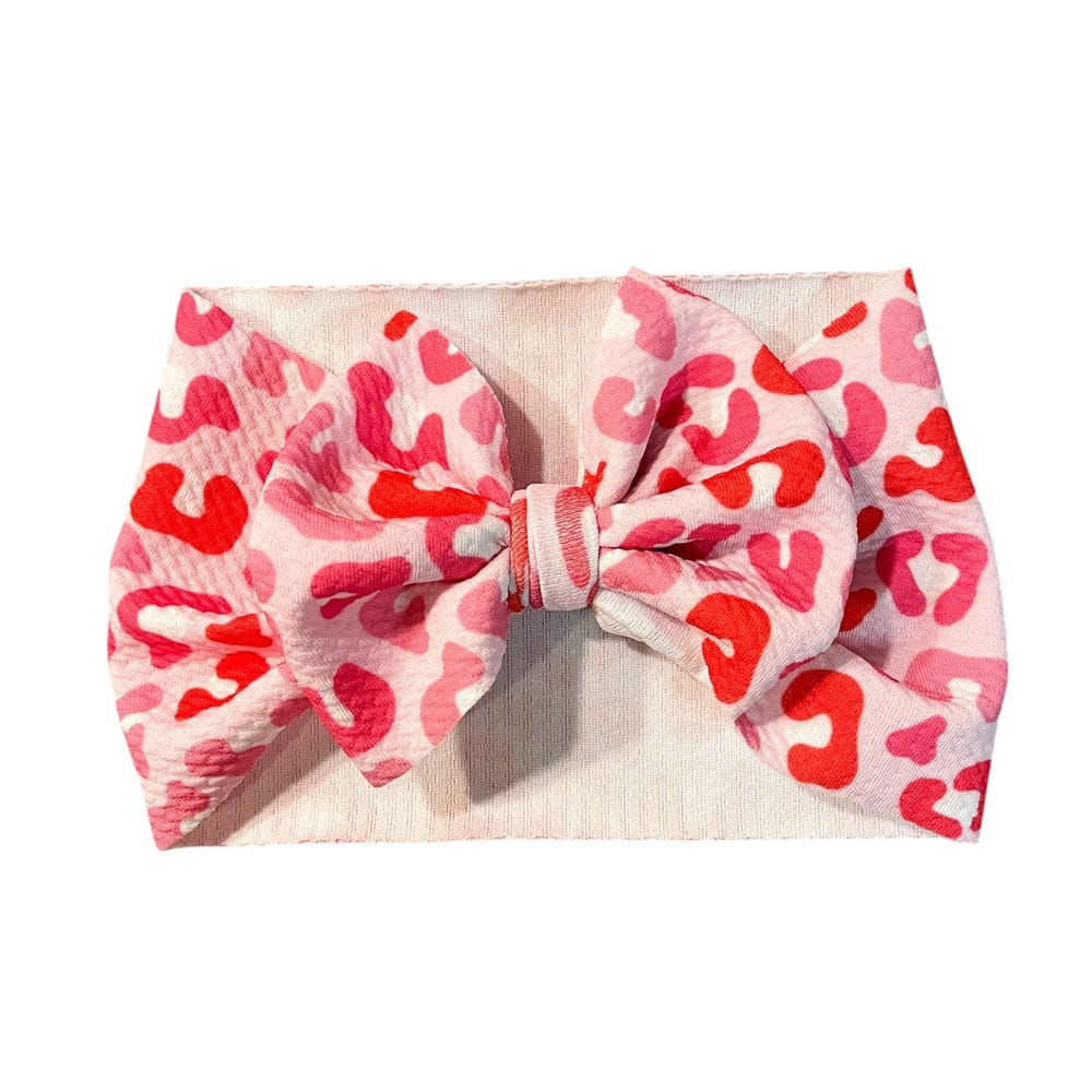 Valentine's Day Cheetah Headwrap Bow for babies - stylish and cute accessory for little ones.