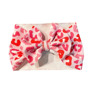 Valentine's Day cheetah headwrap bow for babies, stylish and cute accessory for little ones.