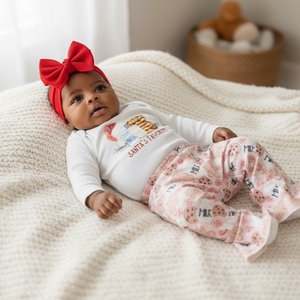 Baby in Santa's Favorite Christmas Milk and Cookies Bell Bottom Outfit, showcasing festive holiday style.