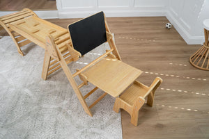 Angle 3 view of Hazel & Olive rocking chair with desk and chair attachment for babies.