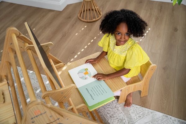 Desk and chair attachment for Hazel & Olive rocking chairs, designed for baby comfort and safety.