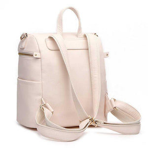 Pastel pink Petit Diaper Bag at angle 2, stylish and functional for parents on the go.