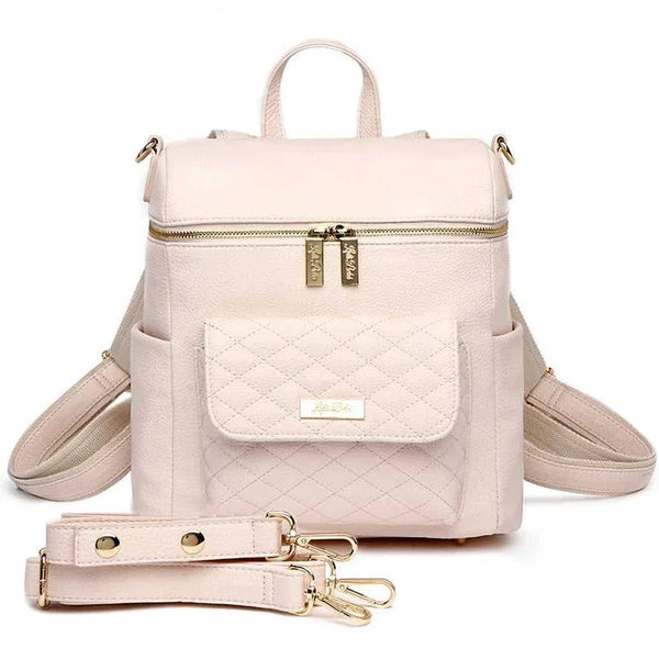 Pastel pink Petit Diaper Bag, stylish and functional for parents on the go.