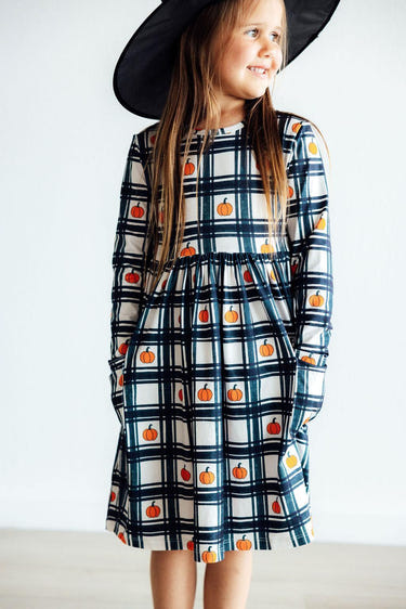 Plaid Pumpkins Long Sleeve Pocket Twirl Dress for babies, perfect for fall fashion and playful twirling.
