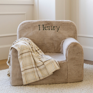Minky stretch receiving blankets in soft pastel colors, angled view showcasing their cozy texture and versatility.