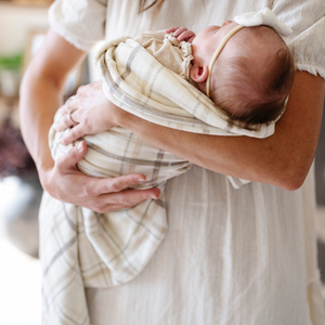 Minky stretch receiving blankets in soft colors, perfect for swaddling and keeping your baby cozy.