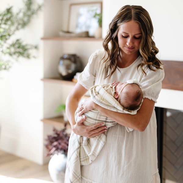 Soft Minky Stretch Receiving Blankets in various colors, perfect for swaddling and keeping your baby cozy.
