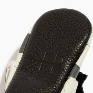 "Playmaker Bow Baby Shoe in angle 4, featuring a cute bow design and soft moccasin style for infants."
