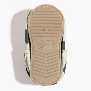 Playmaker Bow Baby Shoe in angle 5 view, featuring a stylish bow design and soft moccasin construction.