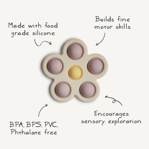 Colorful flower press toy for babies, promoting creativity and fine motor skills. Angle view showcasing vibrant design.