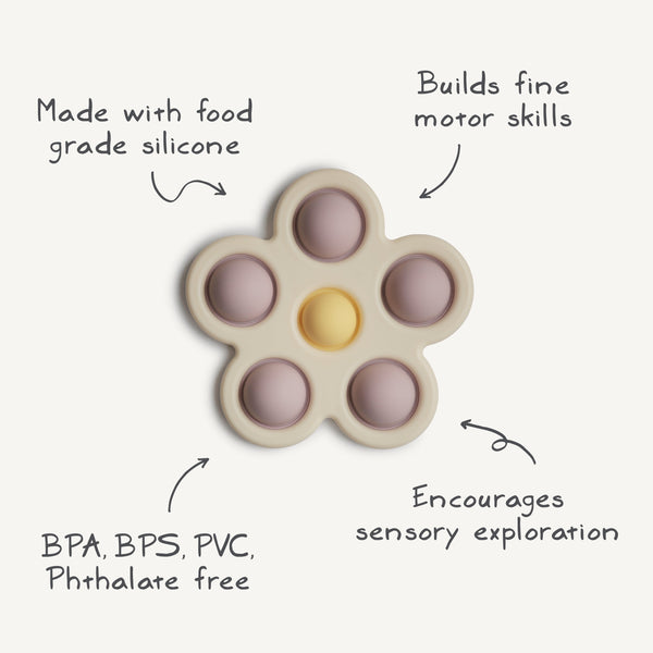 Colorful flower press toy for babies, promoting creativity and fine motor skills. Angle view showcasing vibrant design.