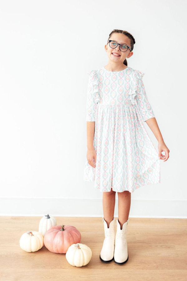 Pumpkin Kisses Harvest Wishes 3/4 Sleeve Ruffle Twirl Dress for babies, angle view showcasing playful design and colors.