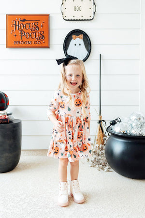 Pumpkin Peekaboo 3/4 Sleeve Twirl Dress with pockets, angle view showcasing playful design for babies.