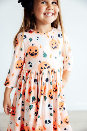 Pumpkin Peekaboo 3/4 Sleeve Twirl Dress with pockets, perfect for playful baby outfits.
