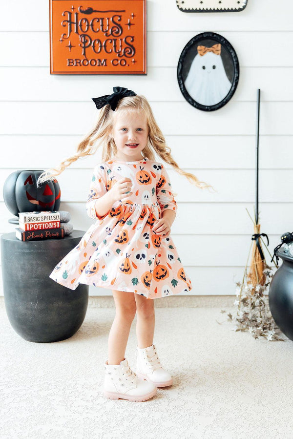 Pumpkin Peekaboo 3/4 Sleeve Pocket Twirl Dress in playful angle, perfect for little ones' fun and style.