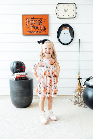Pumpkin Peekaboo 3/4 Sleeve Twirl Dress with pockets, perfect for playful baby outfits.