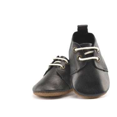Black low top oxfords for babies with soft sole, perfect for stylish and comfortable first steps.
