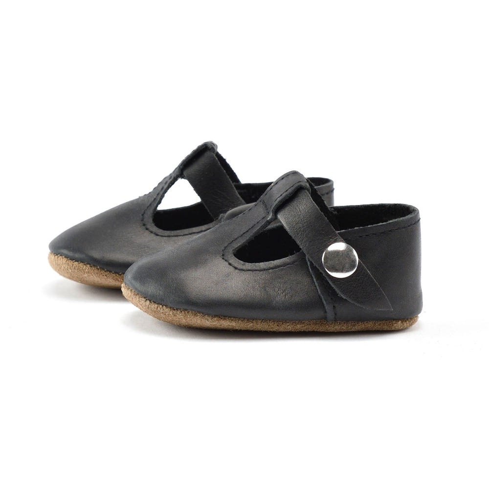 Black T-Strap Mary Jane soft sole baby shoes - stylish and comfortable for little feet.