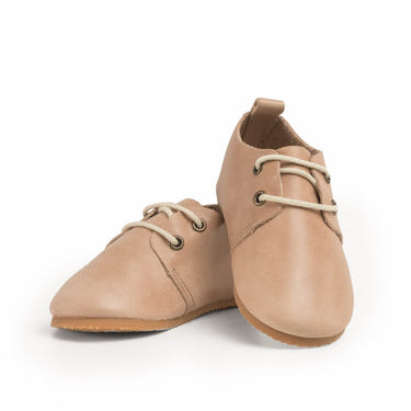 Tan low top oxfords for babies with hard sole, perfect for stylish and comfortable first steps.