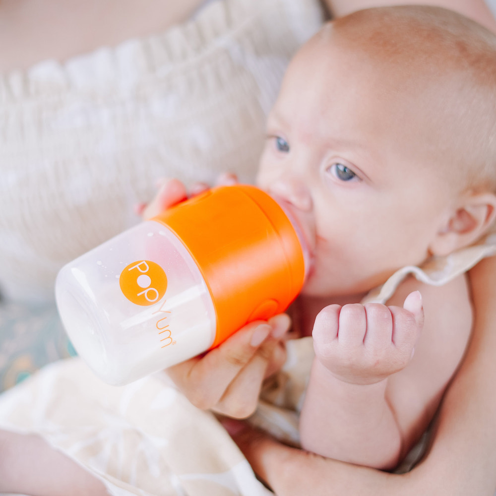 PopYum Baby Bottle Starter Set, 4-pack in orange, includes 2x 5oz and 2x 9oz bottles for breast and formula feeding.