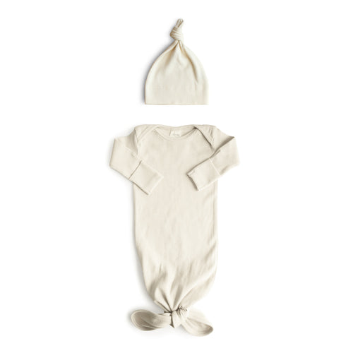 Ribbed knotted baby gown and beanie set in soft fabric, perfect for newborns.