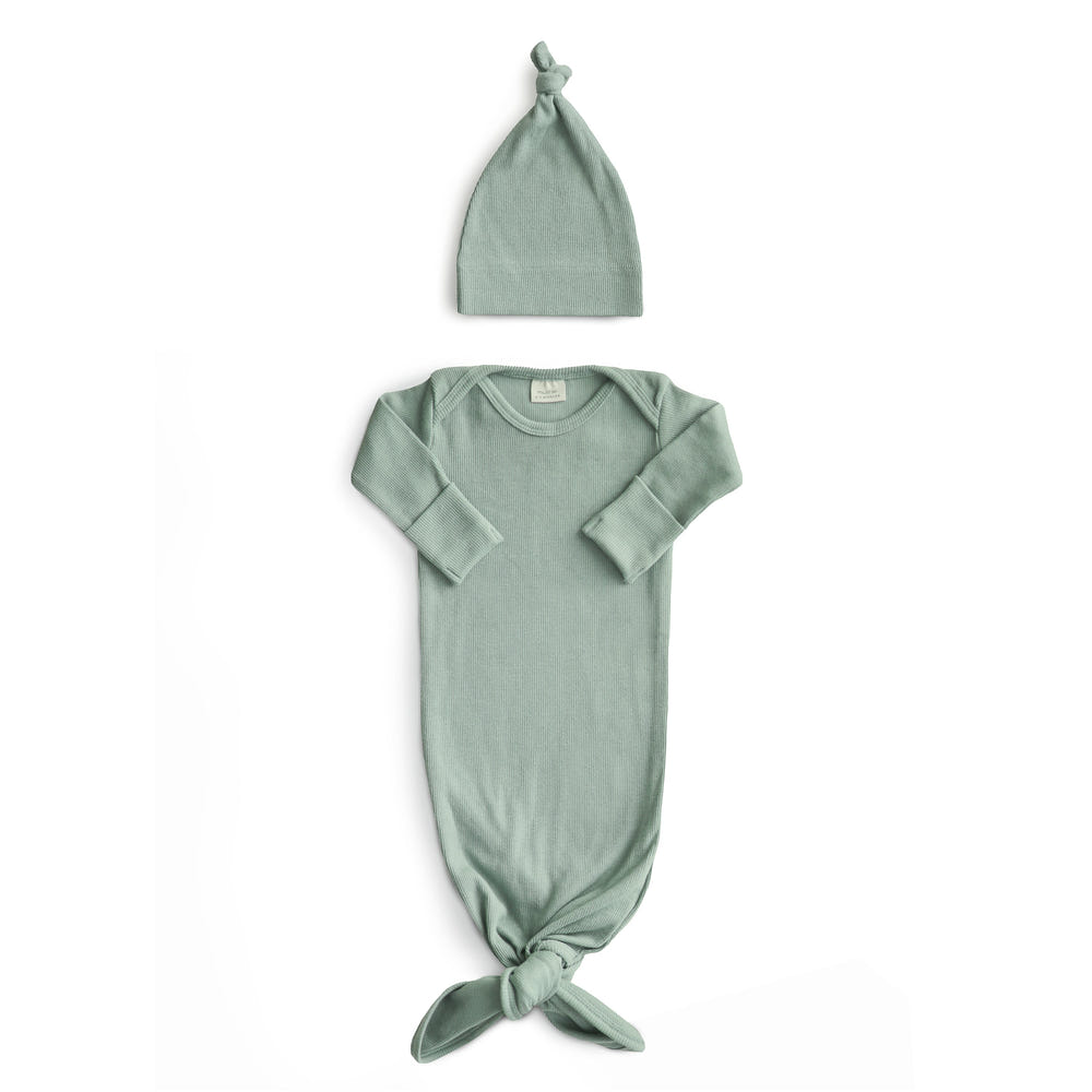 Ribbed knotted baby gown and beanie set in soft fabric, perfect for newborns.