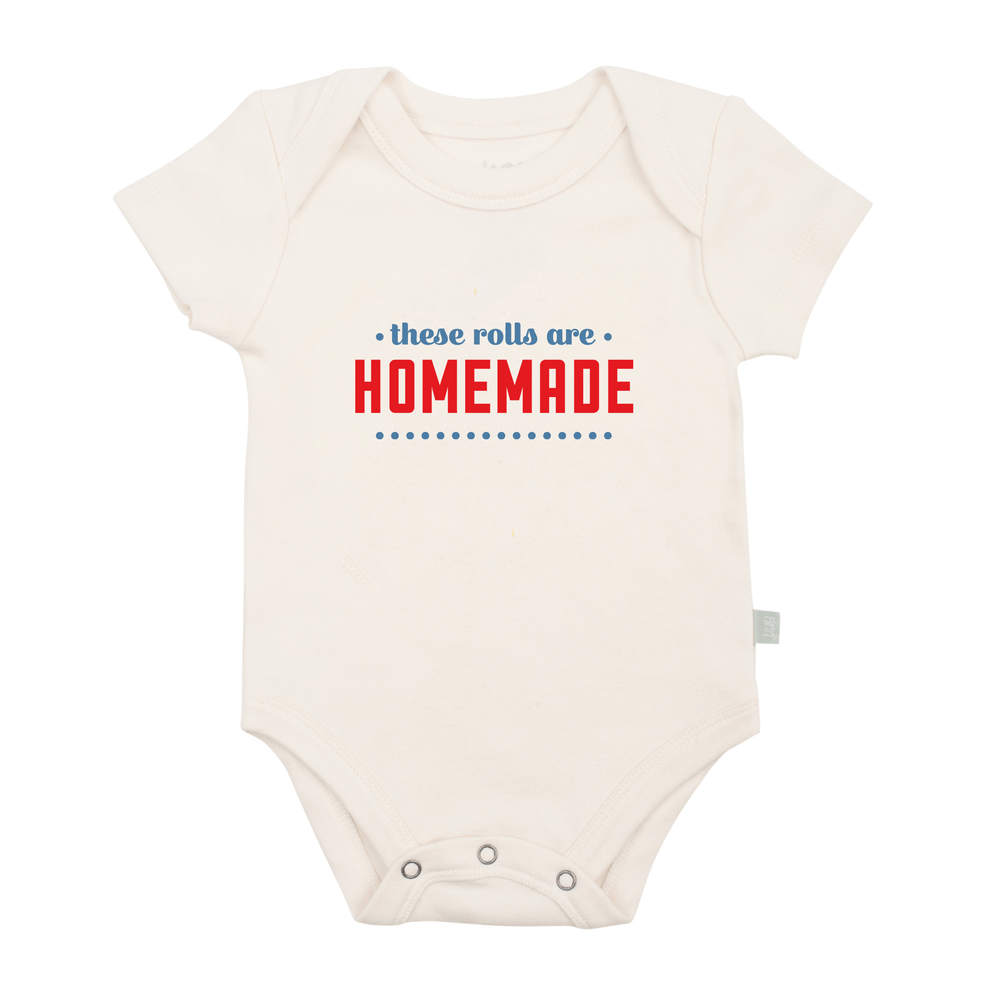 Graphic bodysuit for babies with "these rolls are homemade" design, perfect for stylish and comfy wear.