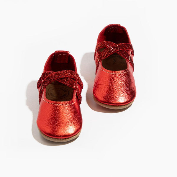 Ruby ballet slipper baby shoe, perfect for little dancers, featuring a soft design and comfortable fit.
