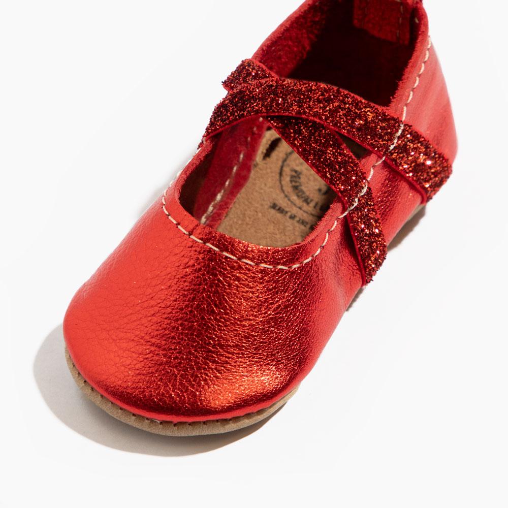 Ruby ballet slipper baby shoe, perfect for little dancers, featuring a soft design and comfortable fit.