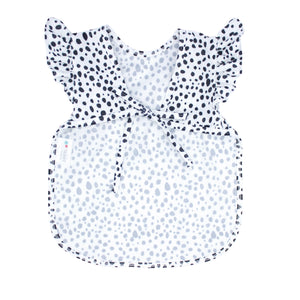 Organic Dot Flutter Bapron for babies, angle view showcasing its cute design and eco-friendly fabric.