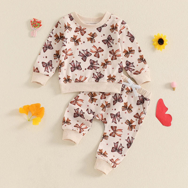Baby toddler girls 2-piece fall jogger set with long sleeve bow print top and drawstring pants outfit.