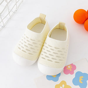 Yellow baby first walkers, perfect shoes for toddlers learning to walk. Comfortable and stylish for little feet.