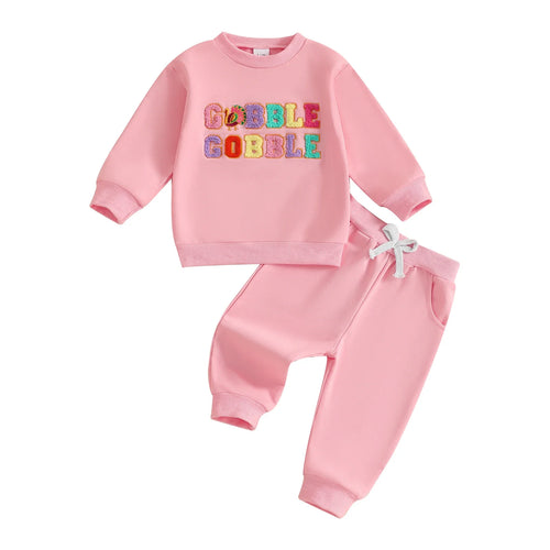 Thanksgiving outfit for baby girls: long sleeve turkey top and jogger pants set, perfect for festive celebrations.