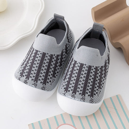 Gray and black baby first walkers, perfect for supporting your baby's first steps in style.
