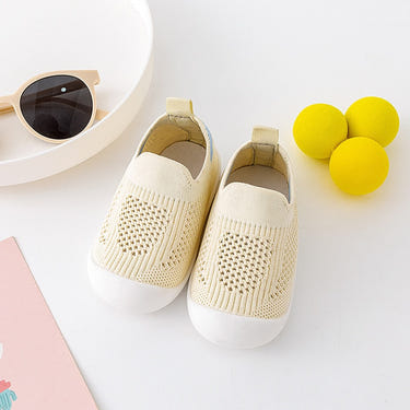 Yellow baby first walkers, perfect for tiny feet taking their first steps. Stylish and comfortable shoes for infants.