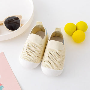 Yellow baby first walkers, perfect for tiny feet taking their first steps. Stylish and comfortable shoes for infants.