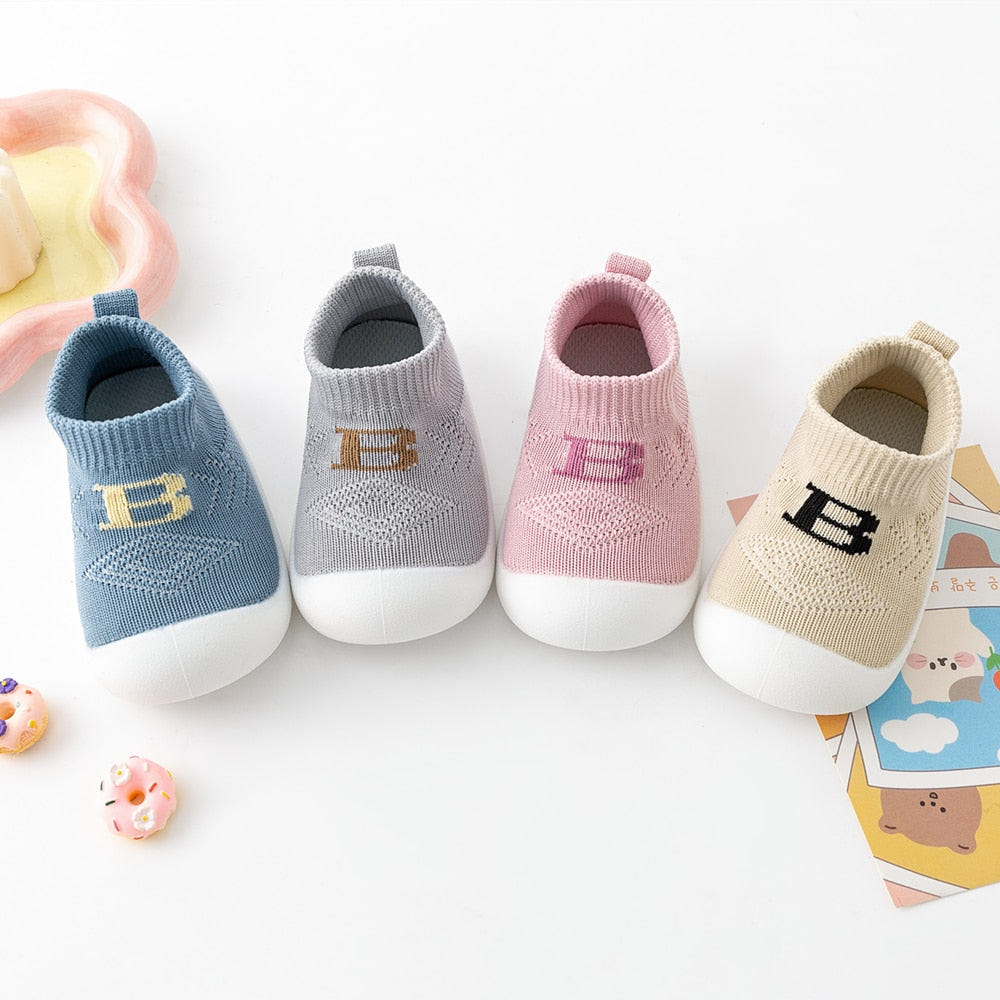 Pink Baby "B" Sock Shoes - Soft, comfortable footwear for infants, perfect for stylish and cozy little feet.