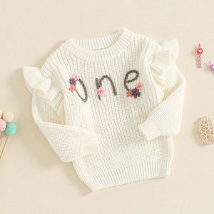 Baby girl birthday sweater with floral embroidery, long sleeve knitted pullover for infants, angle view.