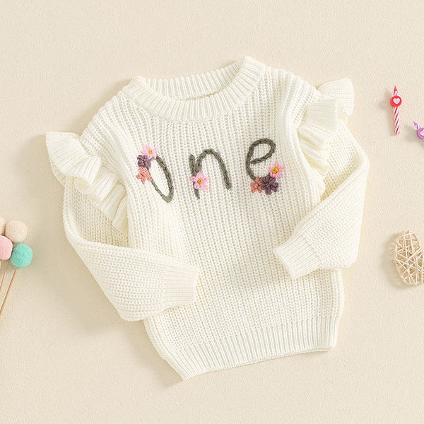 Baby girl birthday sweater with floral embroidery, long sleeve knitted pullover for infants, angle view.