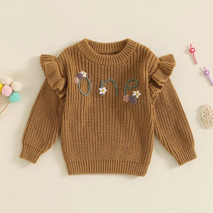 Baby girl birthday sweater with floral embroidery, warm long sleeve pullover for infants, angle view.