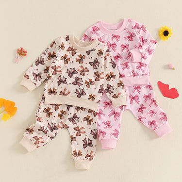 Baby toddler girls 2-piece fall jogger set with long sleeve bow print top and drawstring pants outfit.