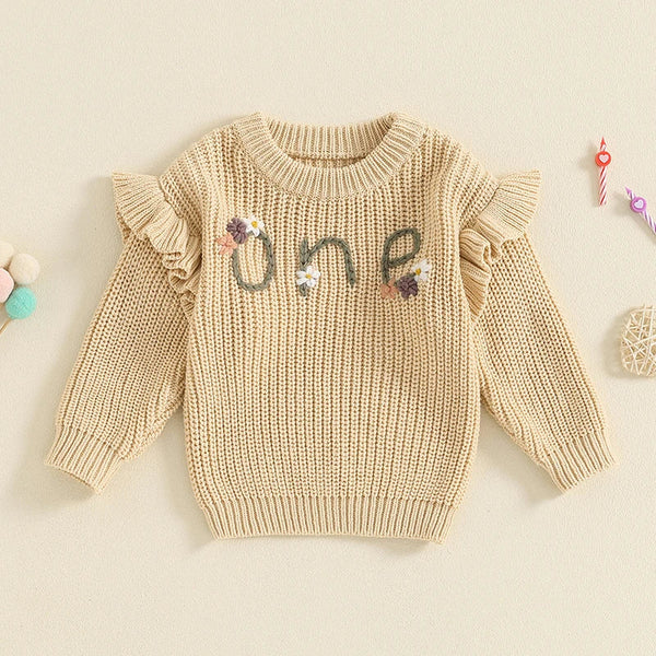 Baby girl birthday sweater with floral embroidery, long sleeve knitted pullover for infants, angle view.