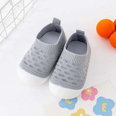 Gray baby first walkers - soft, comfortable shoes for infants taking their first steps.
