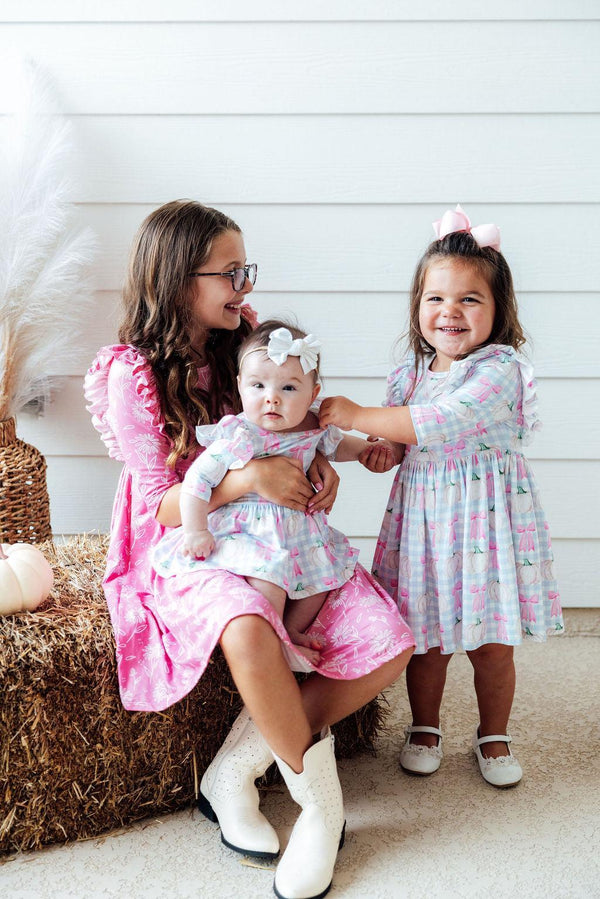 SALE Pumpkin Picnic 3/4 Sleeve Ruffle Twirl Dress for babies, showcased from angle 2, perfect for playful outings.