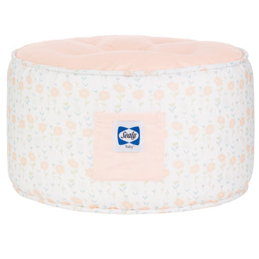 Sealy Pouf in Coral & Blossoms design, perfect for nursery decor and comfortable seating.